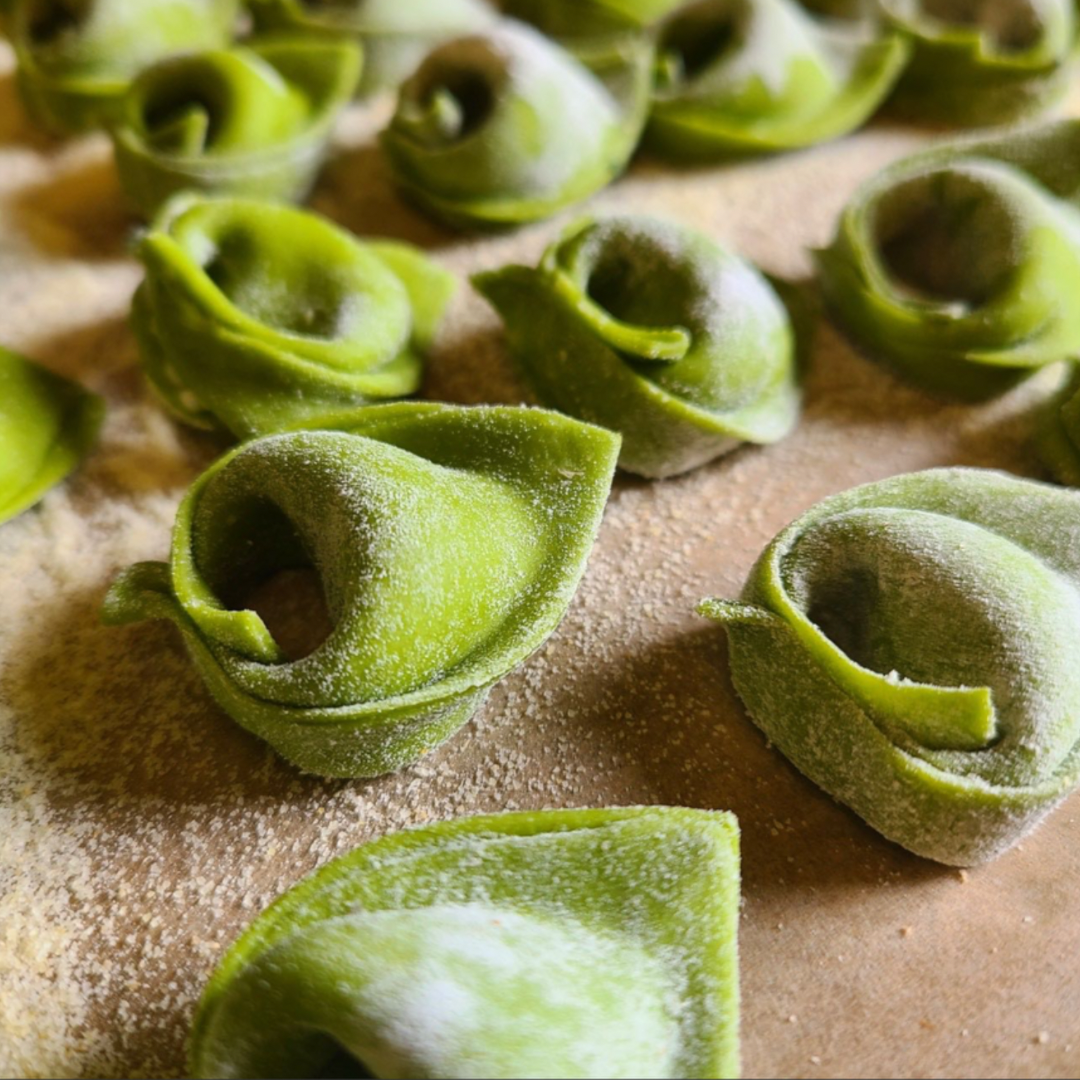 Tortelloni made with a spinach dough and filled with ricotta and herbs