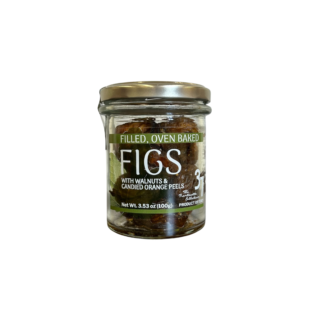 Jar of oven-baked figs with walnuts and candied orange peels on a white background
